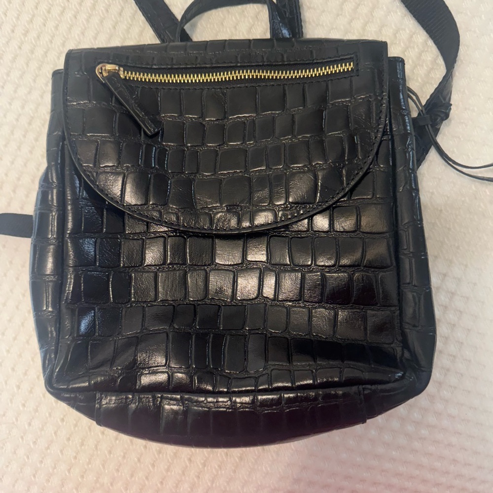 Black Croc-Embossed Women's Backpack measures 9” x 4” x 10”

Perfect condition